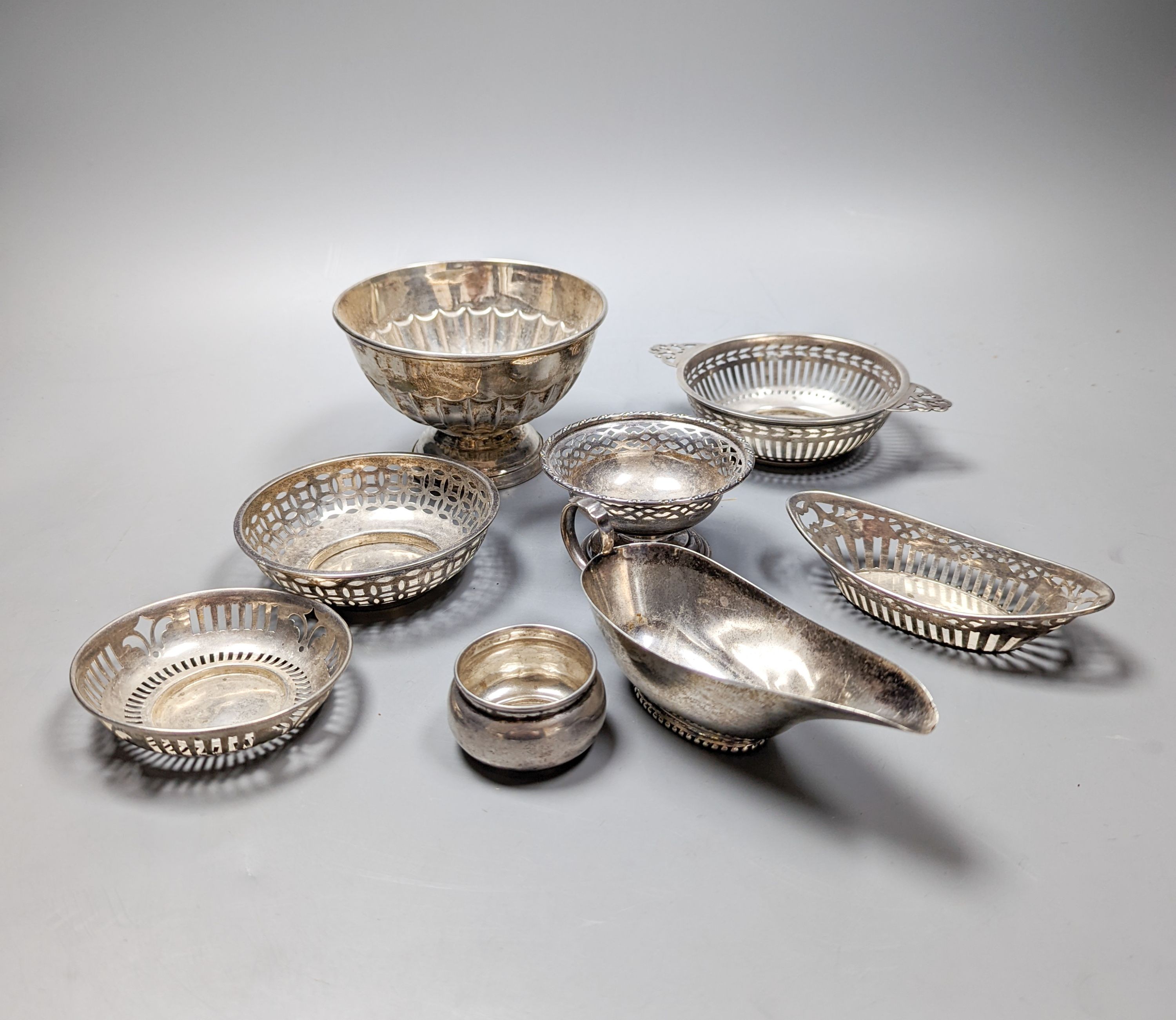 An Edwardian silver bowl, Sheffield, 1904, diameter 11.7cm, five assorted small silver bonbon dishes, a small silver pot and a small silver sauceboat, 12.5oz.